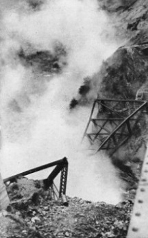 THE OLD BRIDGE over the Salmon River at the moment of its demolition