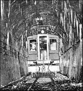 THE LONGEST RAILWAY TUNNEL in the British Empire is the Otira Tunnel in the South Island of New Zealand