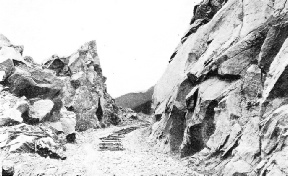 A new cutting, freshly blasted and levelled on a ridge of the Rocky Mountains