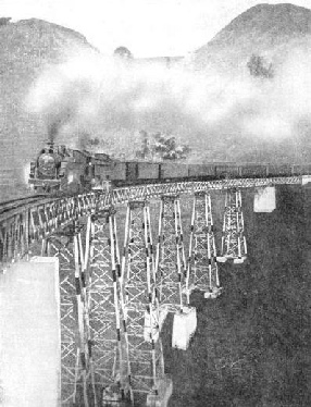 CROSSING A VIADUCT in the Preanger Mountains, Java