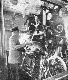 AT THE CONTROLS of a German locomotive