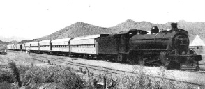 DESOLATE COUNTRY of the nature seen above is traversed by the Sudan Railway expresses