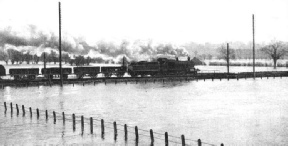 RISING FLOODS imperil the railway track