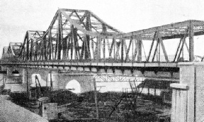 THE RAMA VI BRIDGE which crosses the Menam Chao Phya River at Bangkok