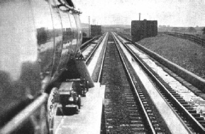 A long drink: a locomotive picking up water at speed