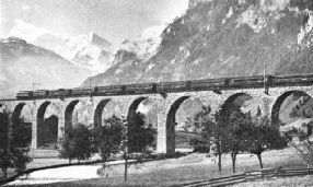 A heavy international express train leaving Frutigen for Kandersteg