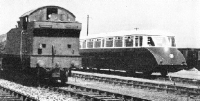 A striking contrast is presented by this juxtaposition of a Great Western Rail Coach and a tank engine